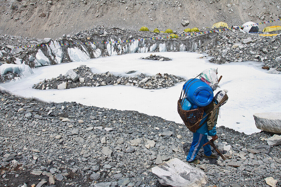 A Nepalese porter carrying supplies to Everest Base camp.