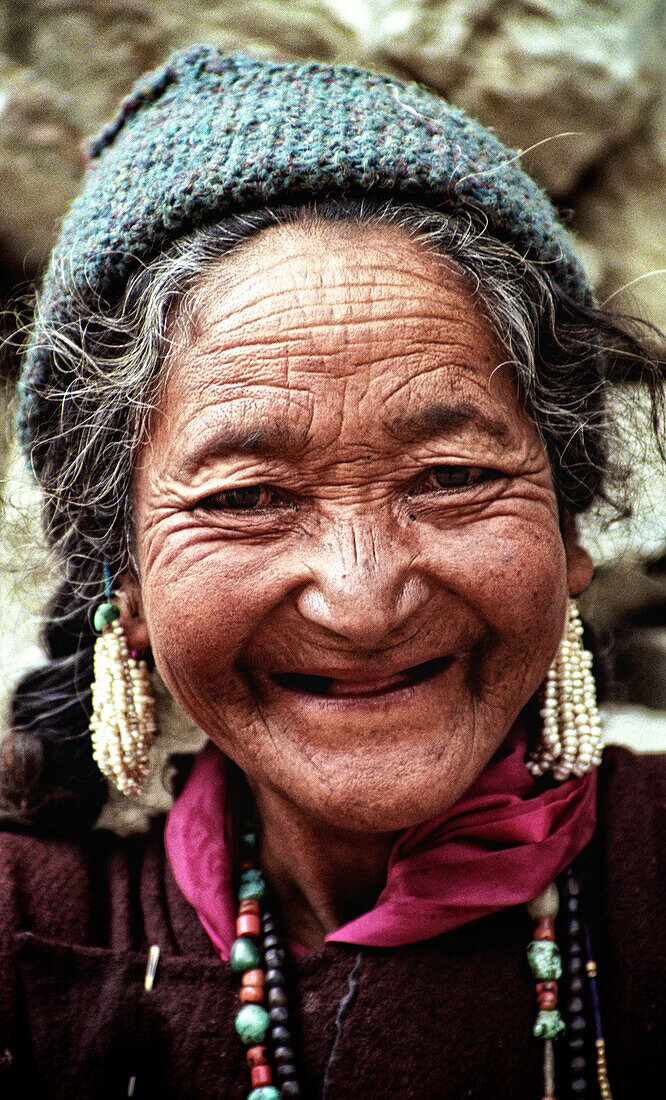 Old woman with a lovely smile without any teeth.   Ladakh, India, 2007.