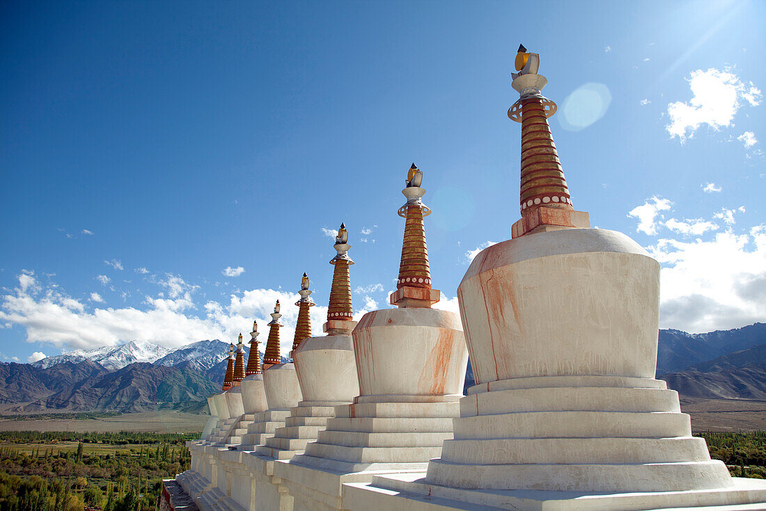 Stupas as seen from Shey Monastery or Gompa. The Shey Palace complex are structures located on a hillock in Shey, 15 kilometers south of Leh in Ladakh, Northern India on the Leh-Manali road. Shey was the summer capital of Ladakh in the past. The palace, m