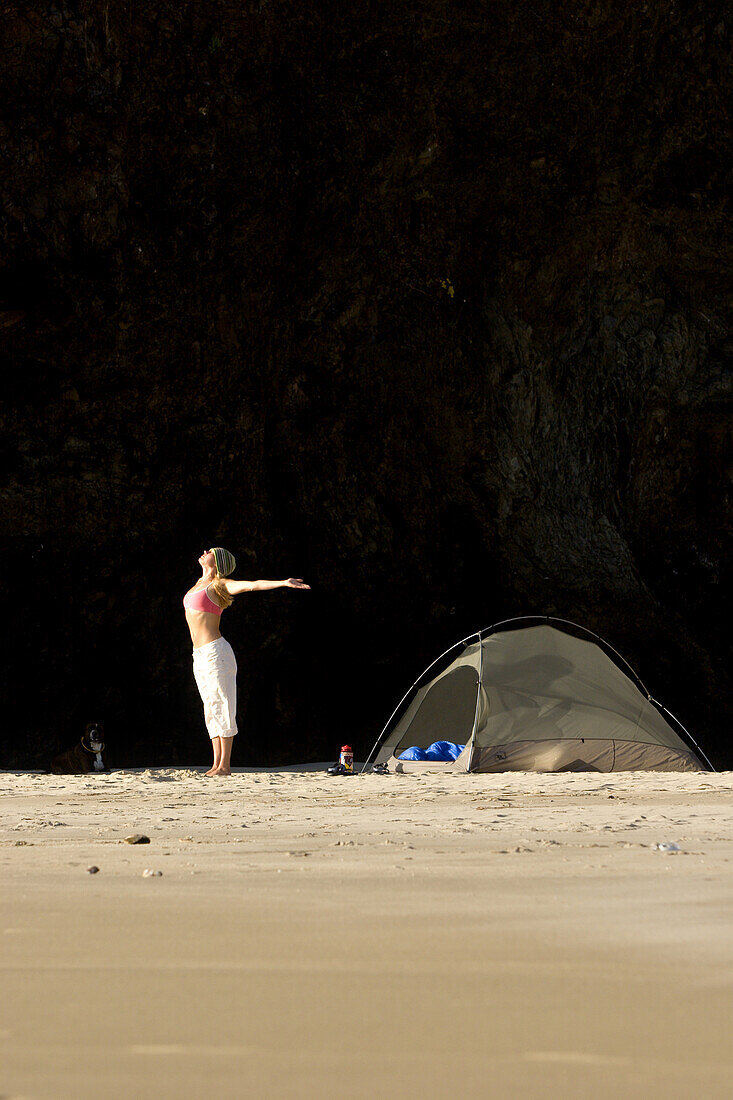 Alicia Ritter doing yoga while camping on a secluded beach in Ecola State Park along the Oregon Coast. Cannon Beach, OR