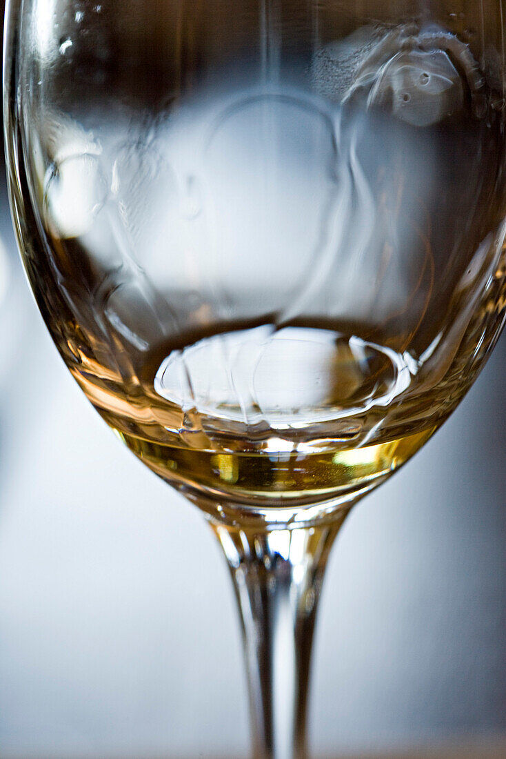 Tears of wine on glass of white wine