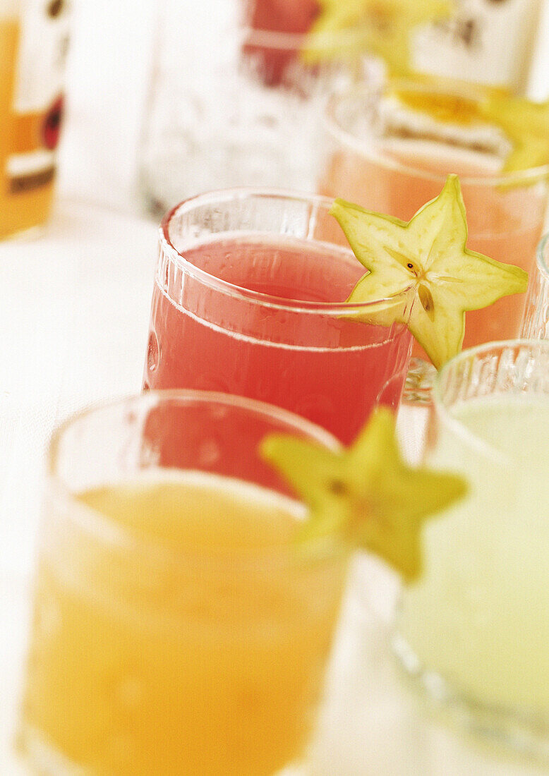 Cocktails garnished with starfruit
