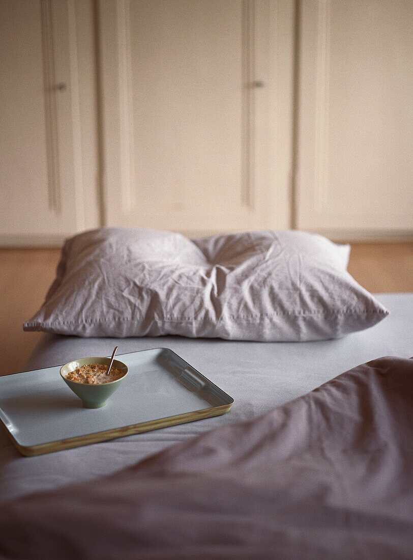 Breakfast tray sitting on bed