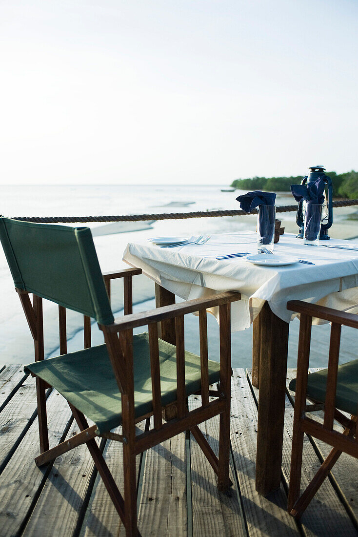 Casual dinner table overlooking sea