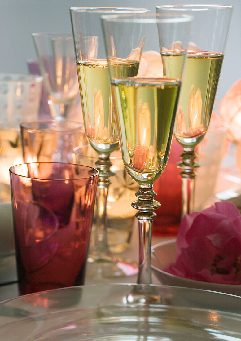 Three glasses of white wine on set table, close-up