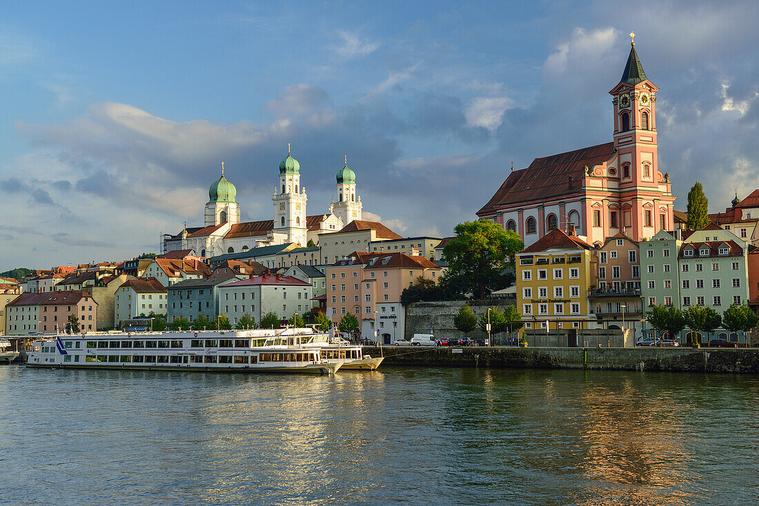 View over Danube river to old town with church of St. Paul and St. Stephans Cathedral, Passau, Lower Bavaria, Germany
