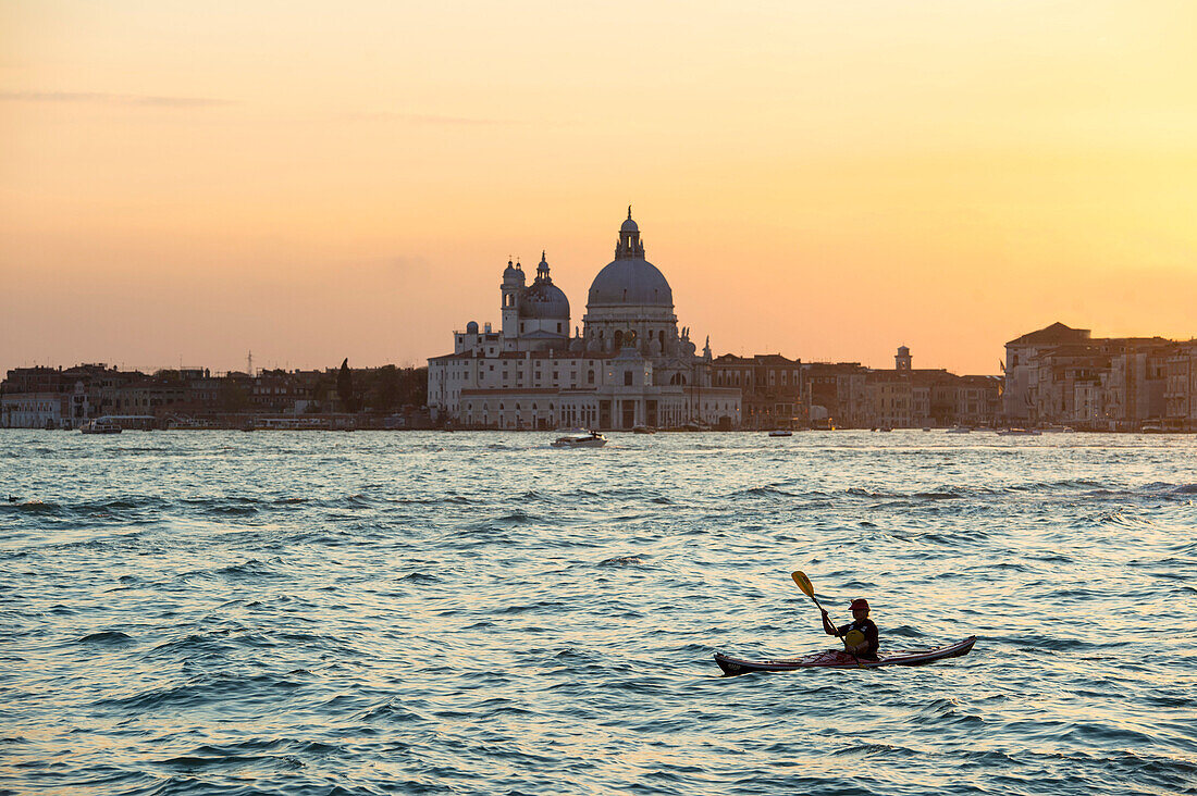Paddler at sunset on Canal Grande, Venice, Italy