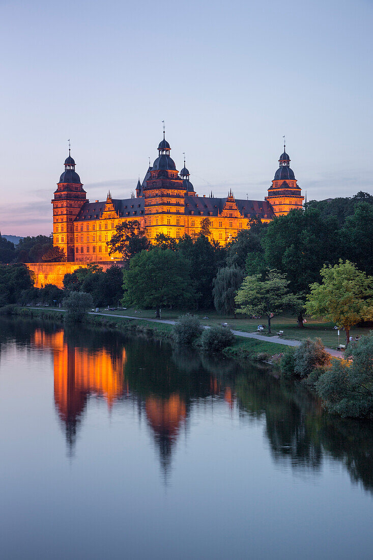 Johannisburg Palace and parklands along the Main river at dusk, Aschaffenburg, Franconia, Bavaria, Germany