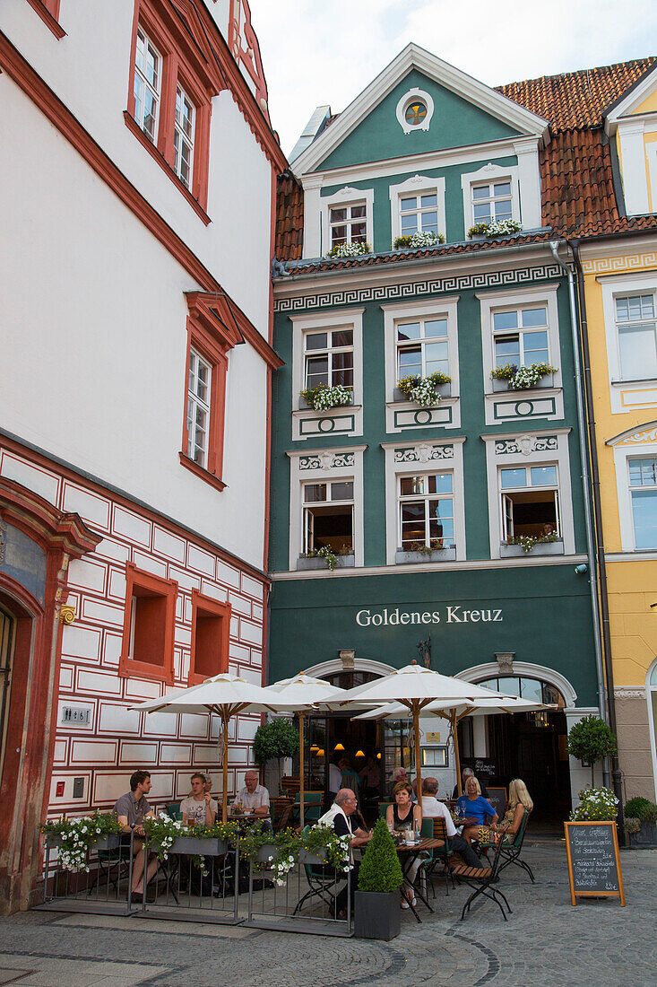 People sitting outside Goldenes Kreuz Restaurant, Coburg, Franconia, Bavaria, Germany