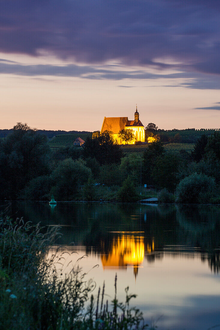 Reflection of Maria im Weingarten pilgrimage church in the Main river at dusk, Volkach, Franconia, Bavaria, Germany