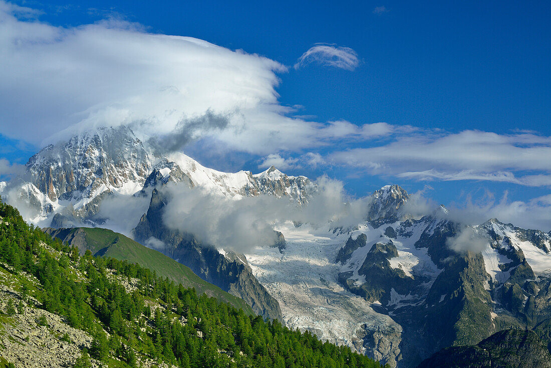 Clouds over Mont Blanc, Mont Maudit and Mont Blanc du Tacul, Lac d'Arpy, Graian Alps range, valley of Aosta, Aosta, Italy