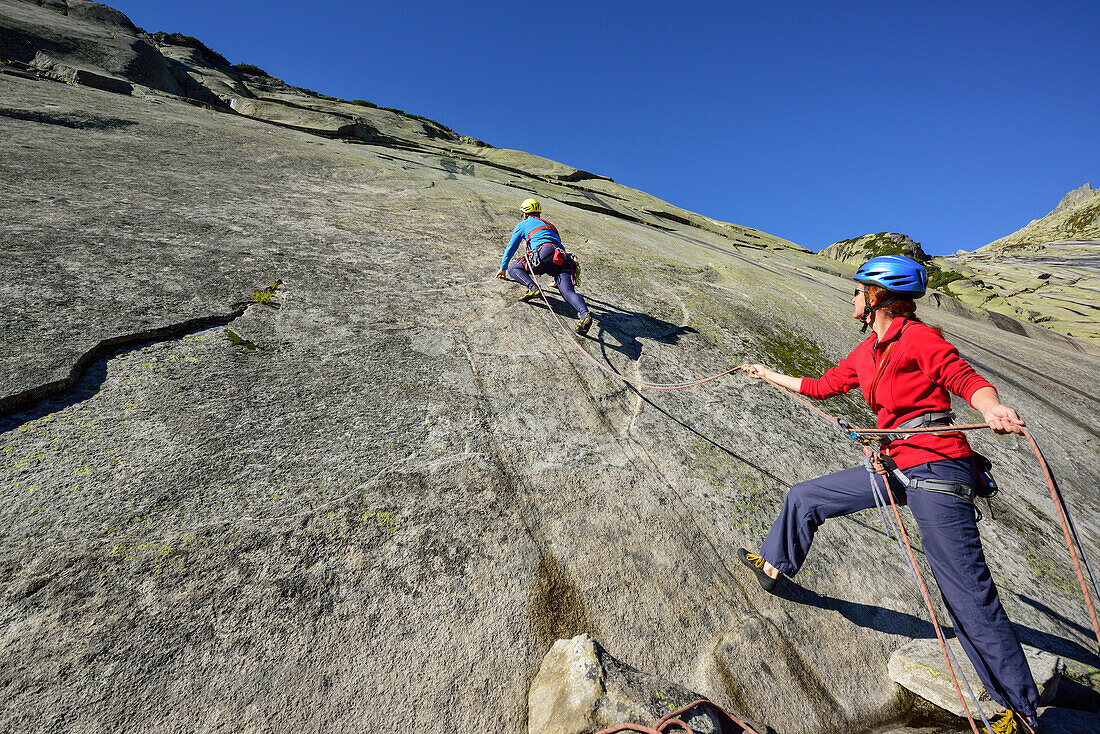 Two people climbing a rock face, Azalee Beach, Grimsel pass, Bernese Oberland, Switzerland