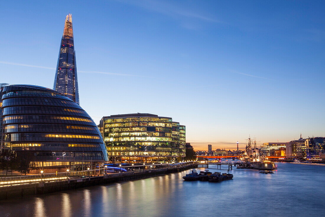 London skyline at dusk including the GLC building, HMS Belfast and the Shard, taken from Tower Bridge, London, England, United Kingdom, Europe