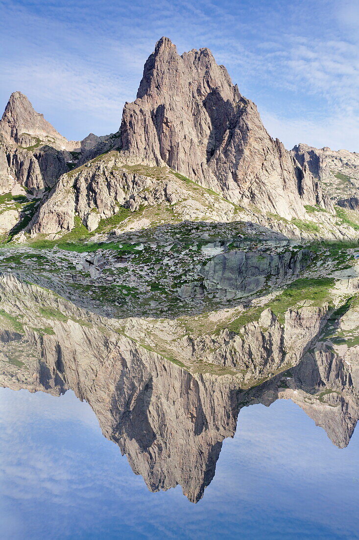 Pic Lombarduccio reflecting in Lac de Melo, Gorges de la Restonica, Haute Corse, Corsica, France, Mediterranean, Europe