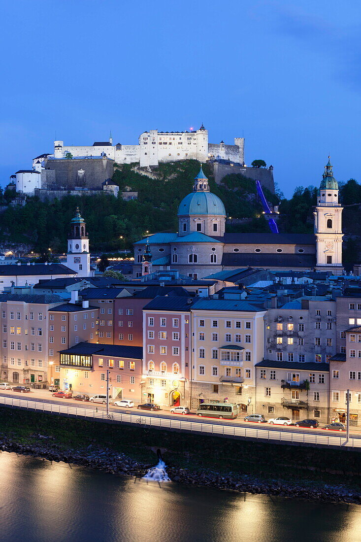 High angle view of the old town, UNESCO World Heritage Site, with Hohensalzburg Fortress, Dom Cathedral and Kappuzinerkirche Church at dusk, Salzburg, Salzburger Land, Austria, Europe