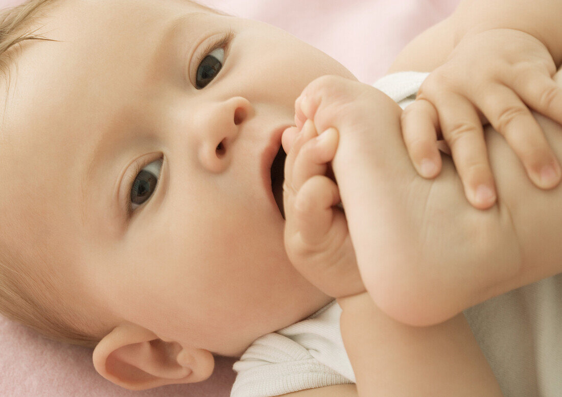 Baby putting foot in mouth