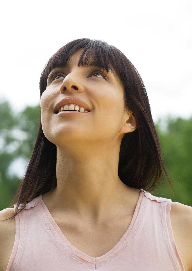 Young woman looking up, portrait