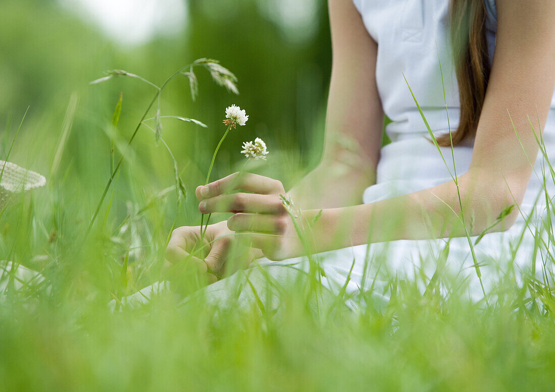 Girl picking flowers