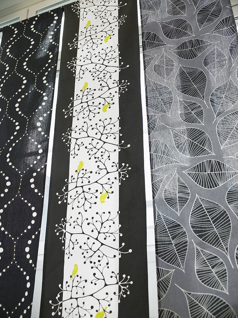 Black and white patterned lengths of fabric