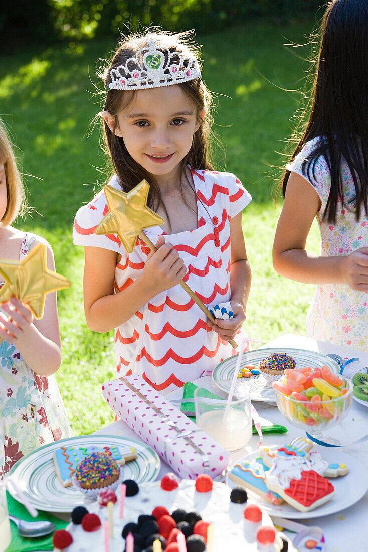Girl in costume at outdoor birthday party