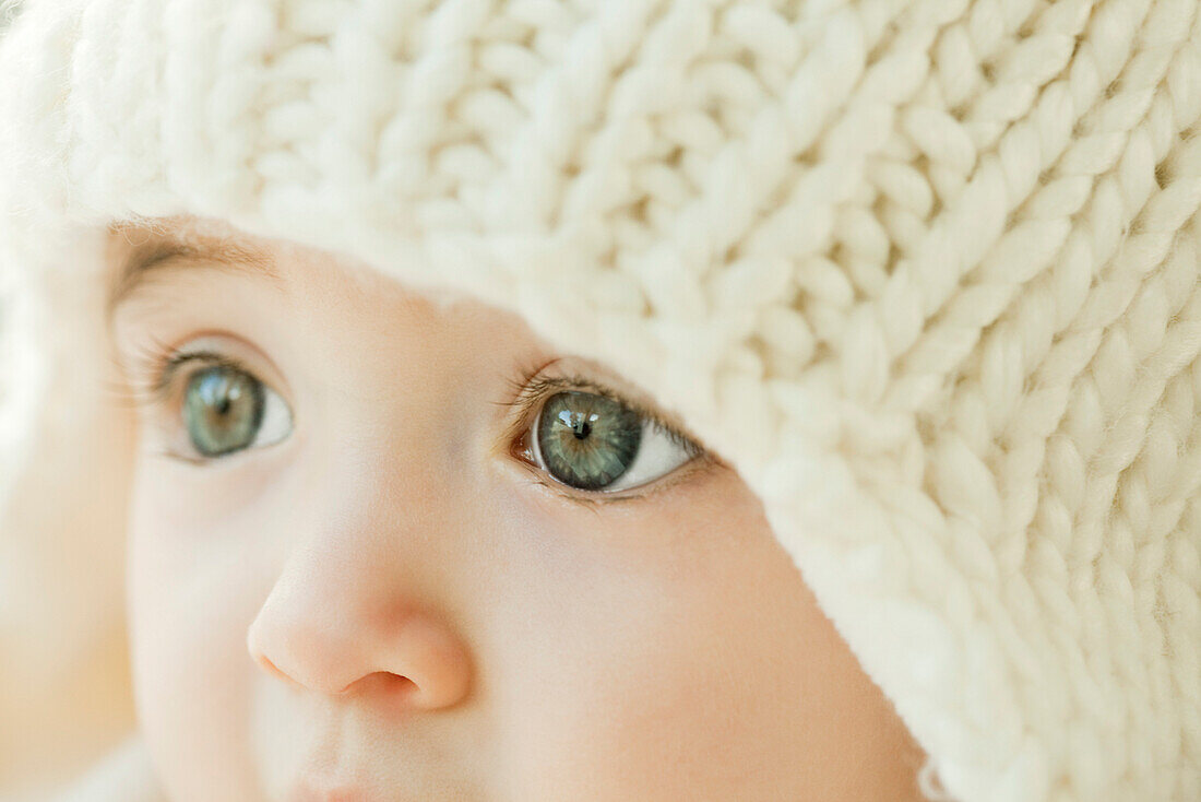 Baby wearing knit hat, close-up