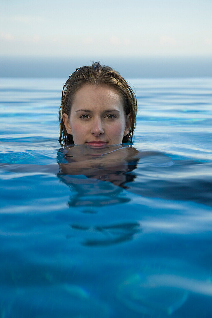 Woman relaxing in water, portrait