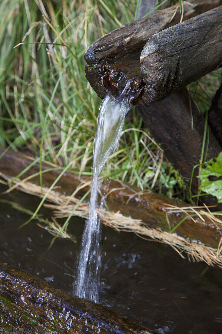 Water running from a wooden drain