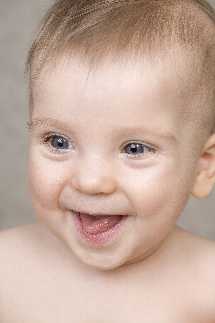 A laughing baby boy, portrait
