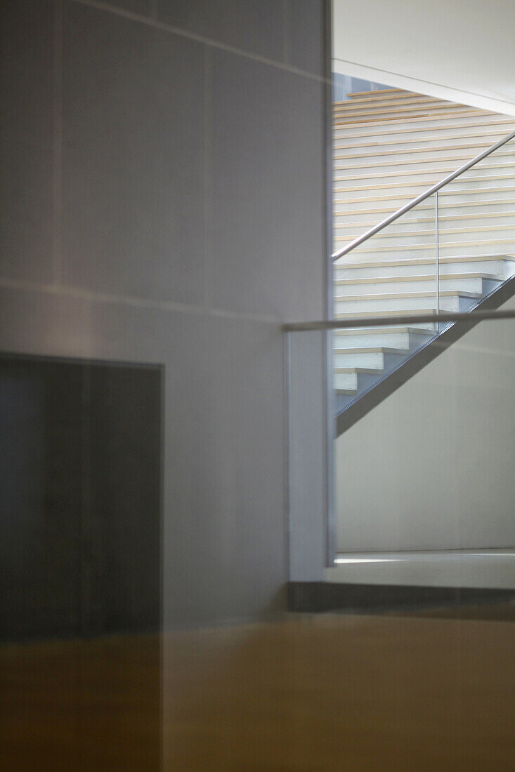 Corridor, floor and wall viewed through window, making geometric shapes