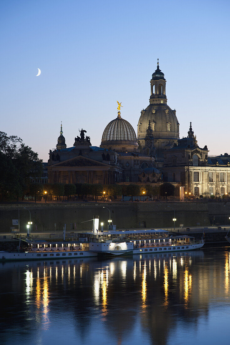 A tour boat on the Elbe River waterfront of Dresden, Germany