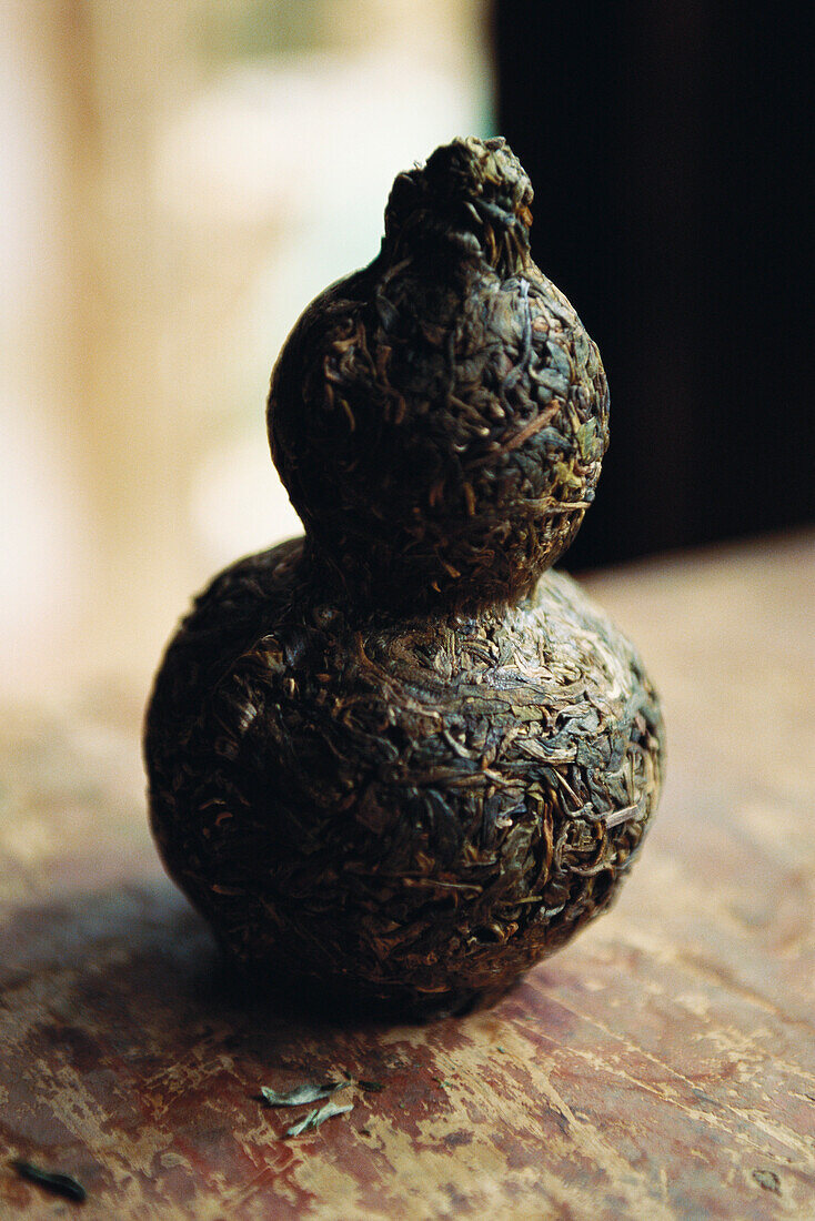 Tea leaves pressed in form of vase