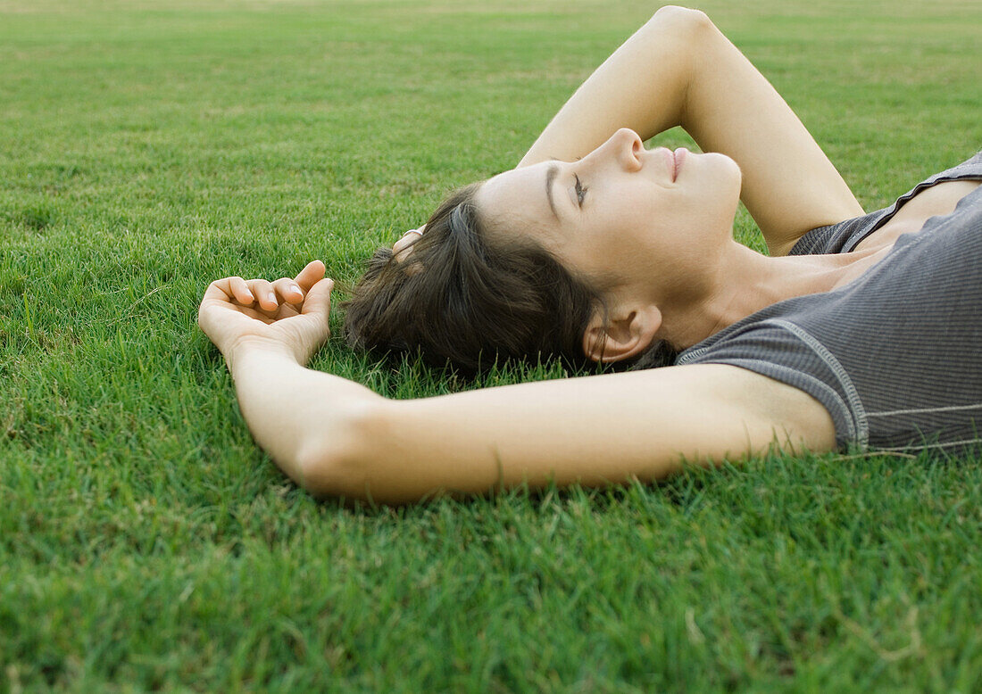 Woman lying in grass