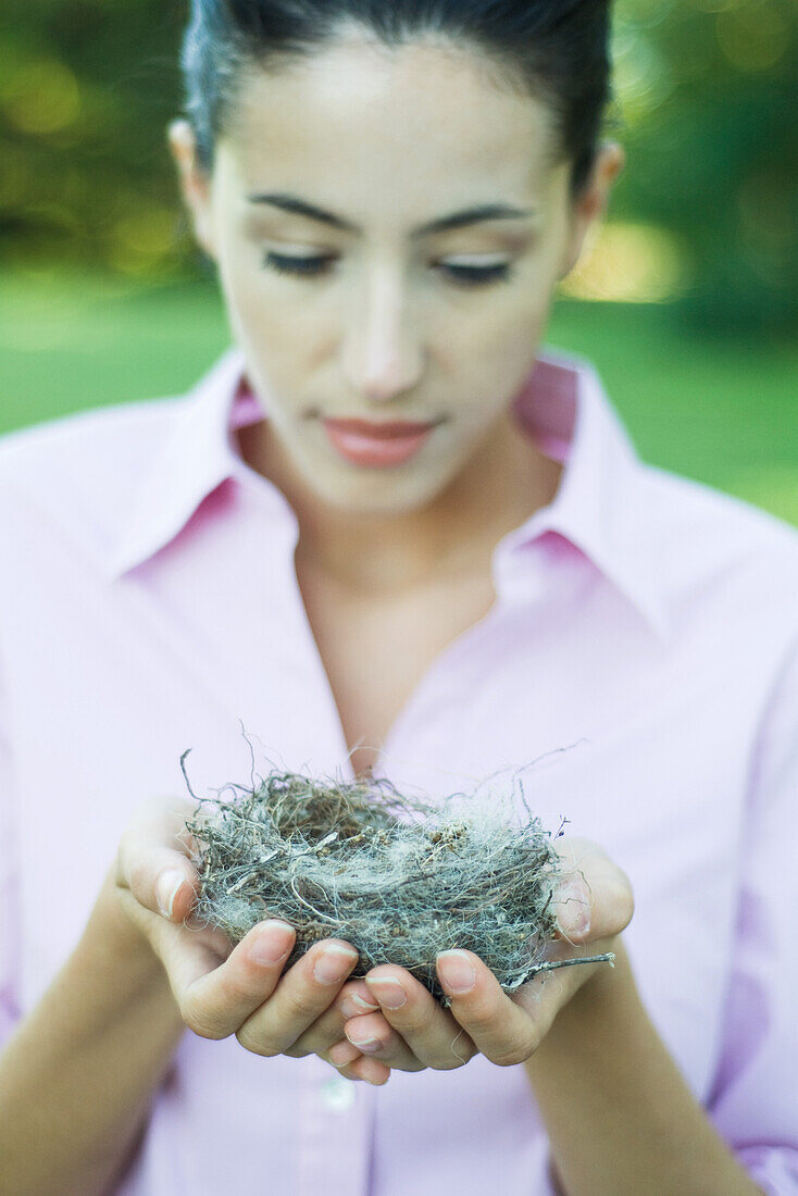 Woman holding nest