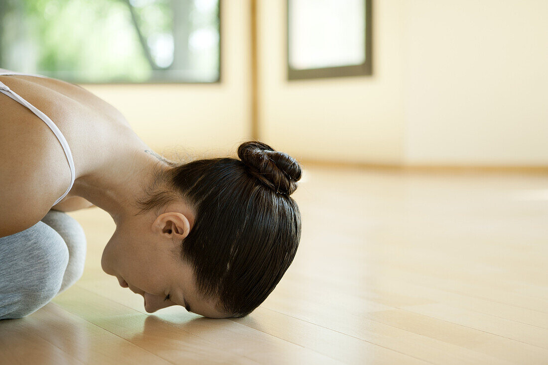 Woman resting in child's pose