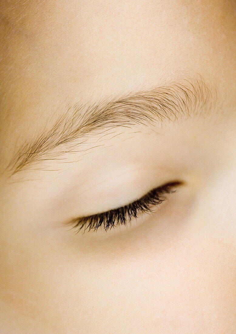 Girl's closed eye, extreme close-up