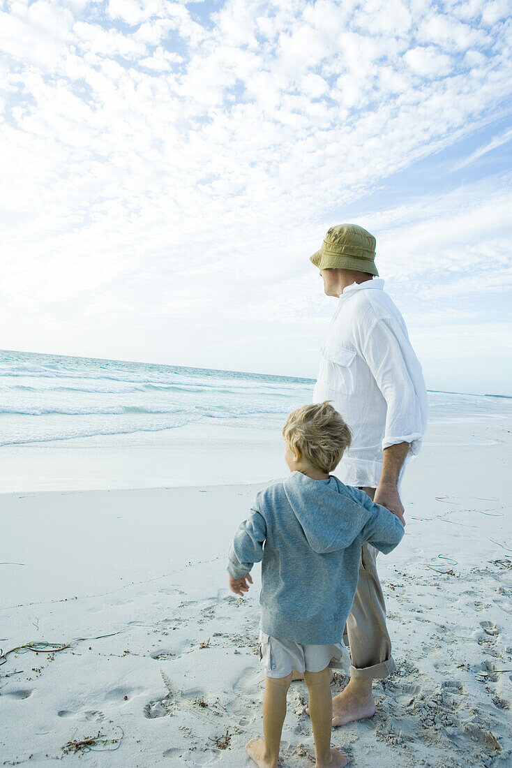 Boy and grandfather on beach