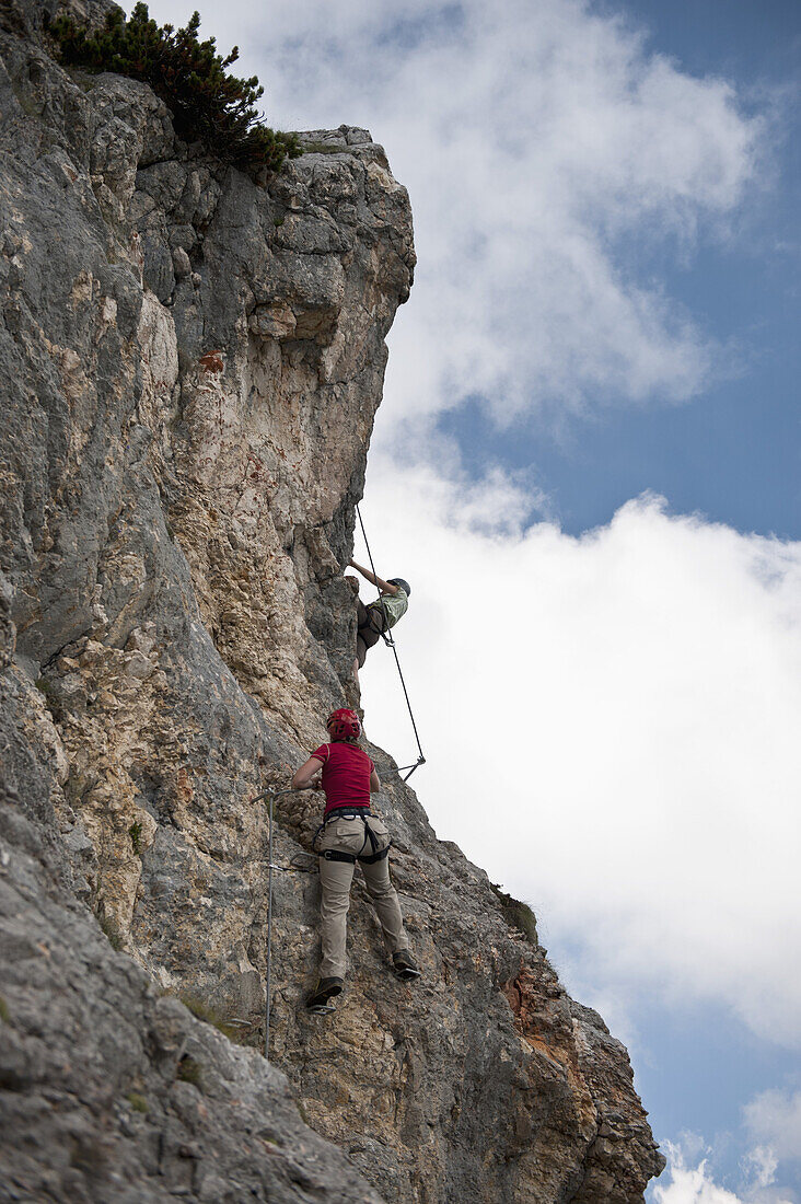 Two people climbing rock face at The Wetterstein, Tirol, Austria