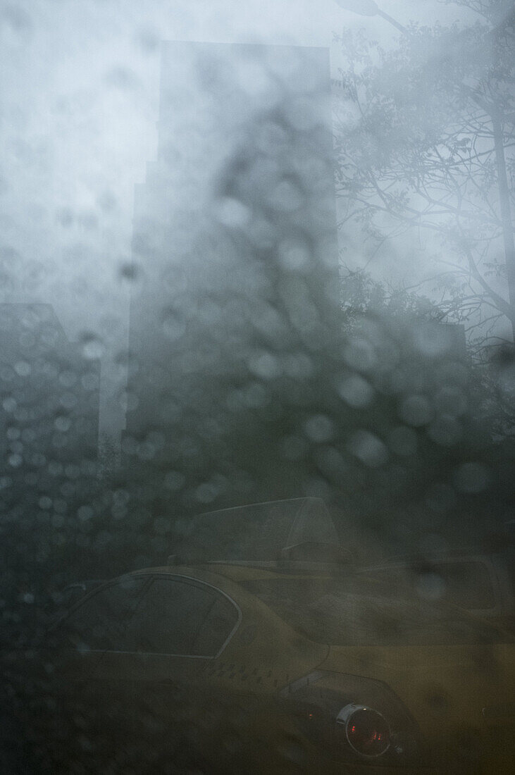 Taxi viewed through rainy window