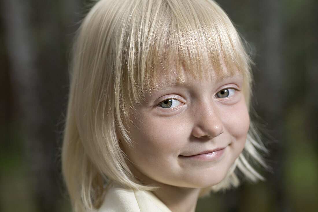 A young smiling girl, close-up