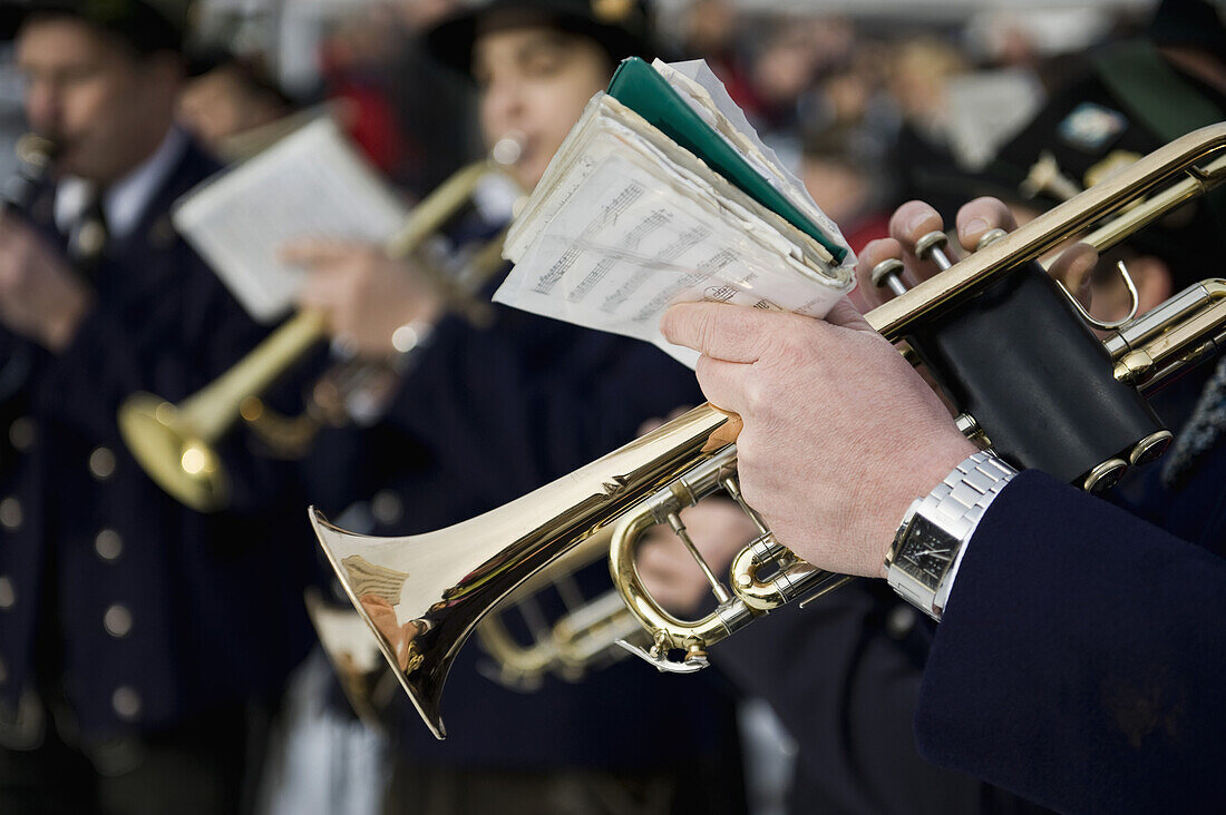 Person playing a trumpet in a marching band