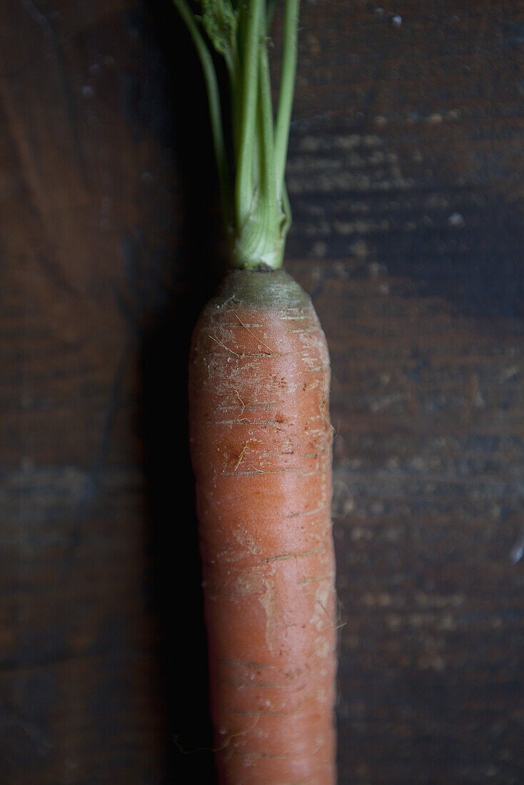 Cropped image of carrot on table