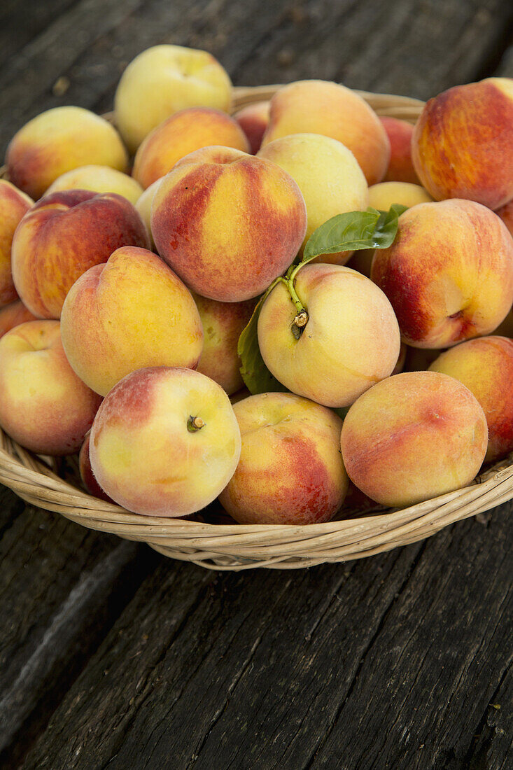 Close-up of peaches in basket