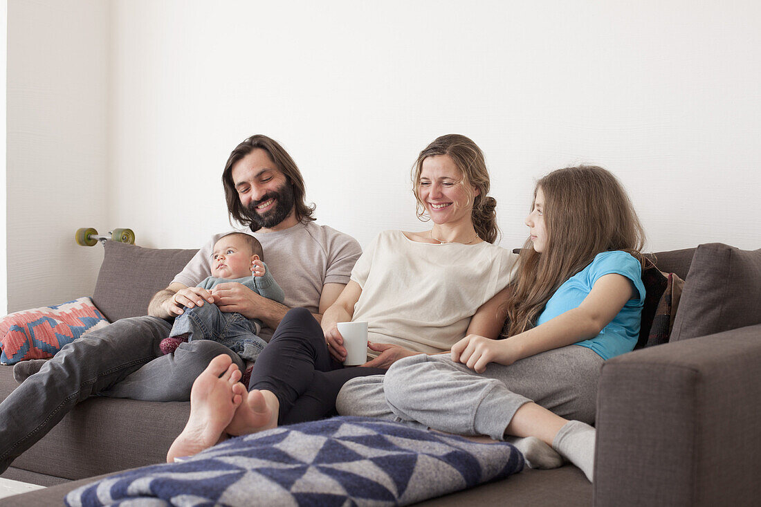 Happy family spending leisure time in living room