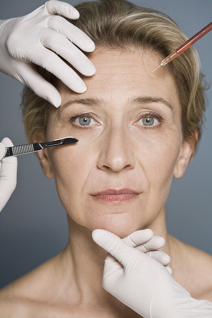 Woman thinking about plastic surgery, Close-up
