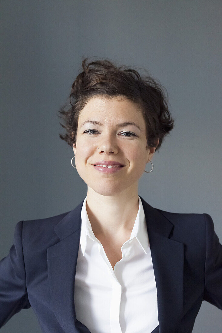 Portrait of mid adult woman smiling, close-up