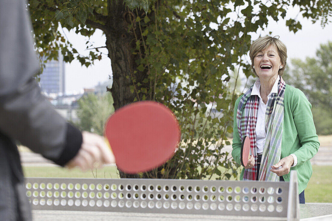 Couple playing table tennis