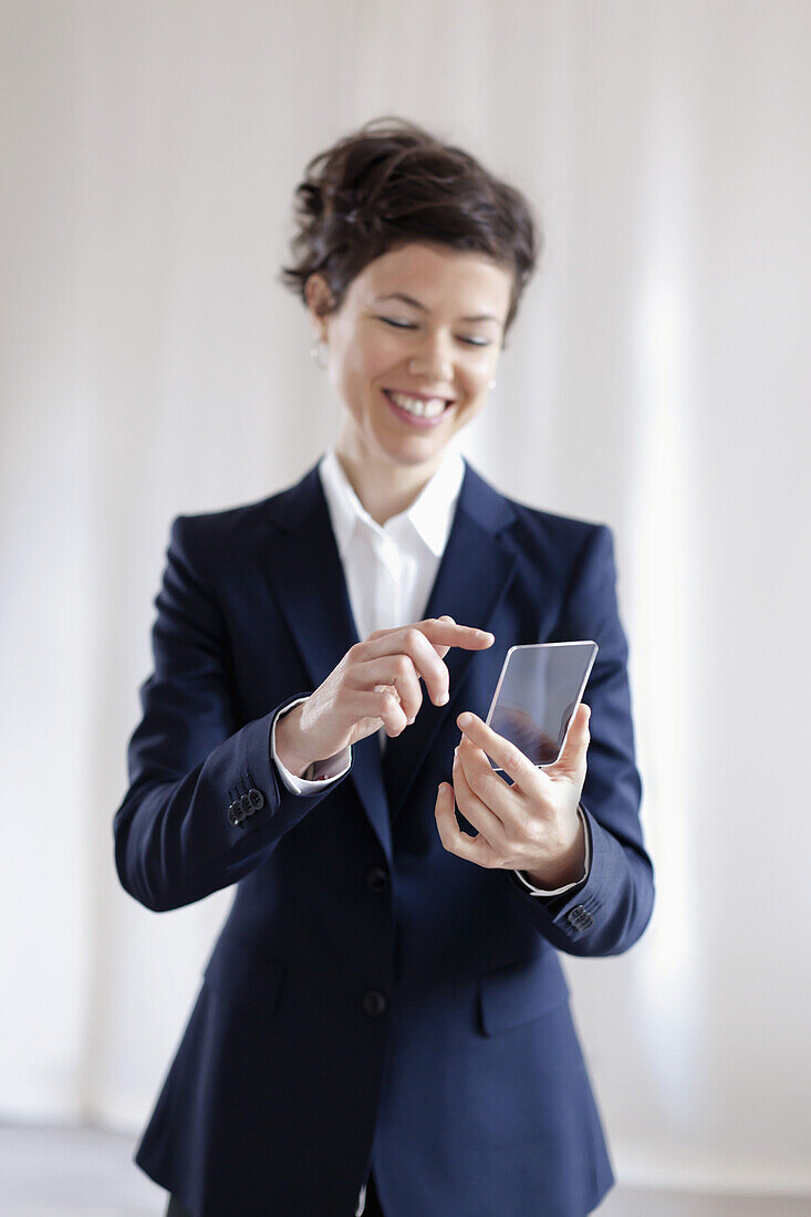 Attractive Businesswoman Holding Virtual Smart Phone