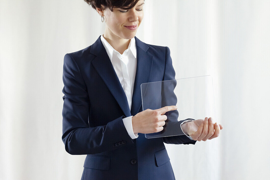 Confident Businesswoman Pointing On Modern Blank Electronic Digital Screen
