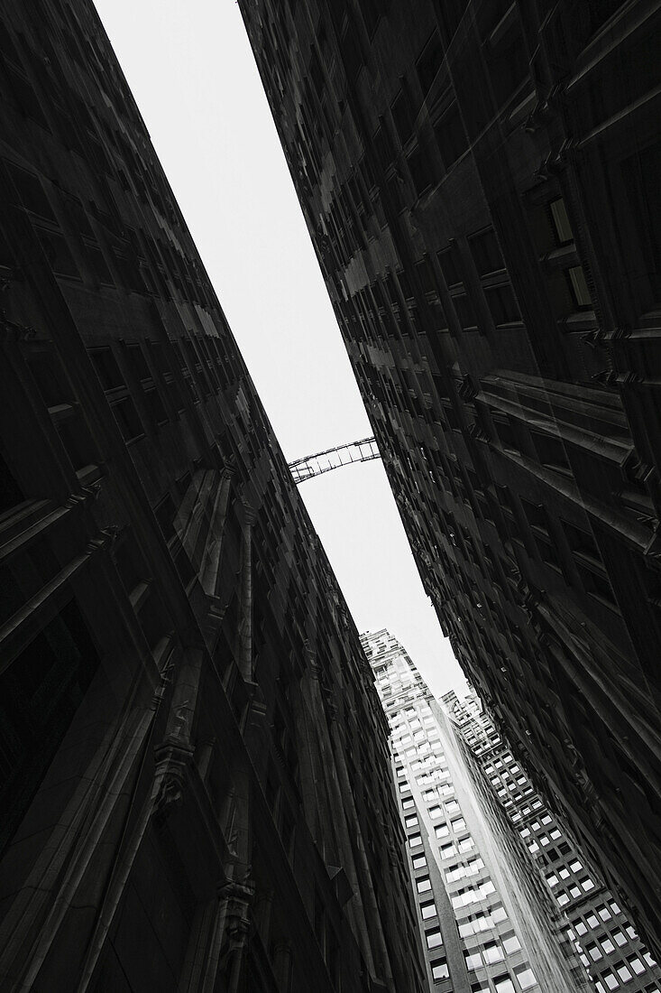 Distant view of footbridge between two building facades in Financial district, Manhattan, USA