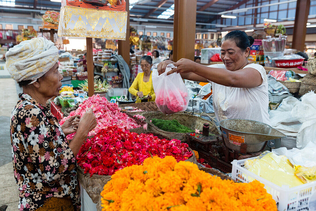 Flower stall inside a market hall, Semarapura, Klungkung, Bali, Indonesia